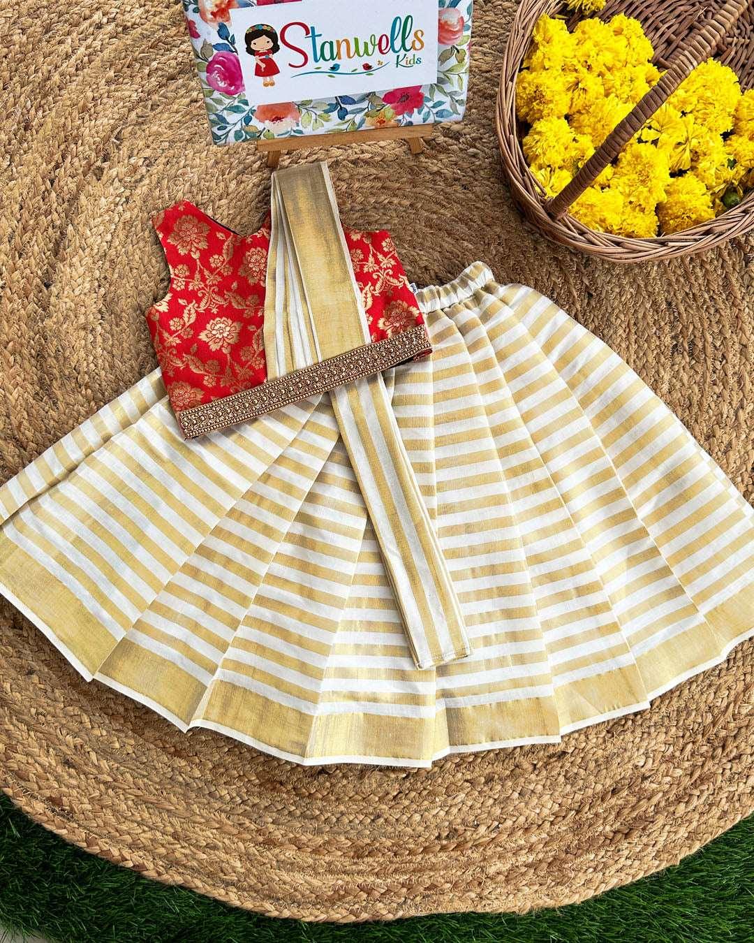 Cream, Gold & Red Jacquard Semi- Dhavani Type Handwork Lehenga Choli
Skirt : Cream &amp; Gold type handloom Kerala kasavu fabric with horizontal golden lines . Inner portion of the skirt is covered with soft cotton lining fabric. Cen
