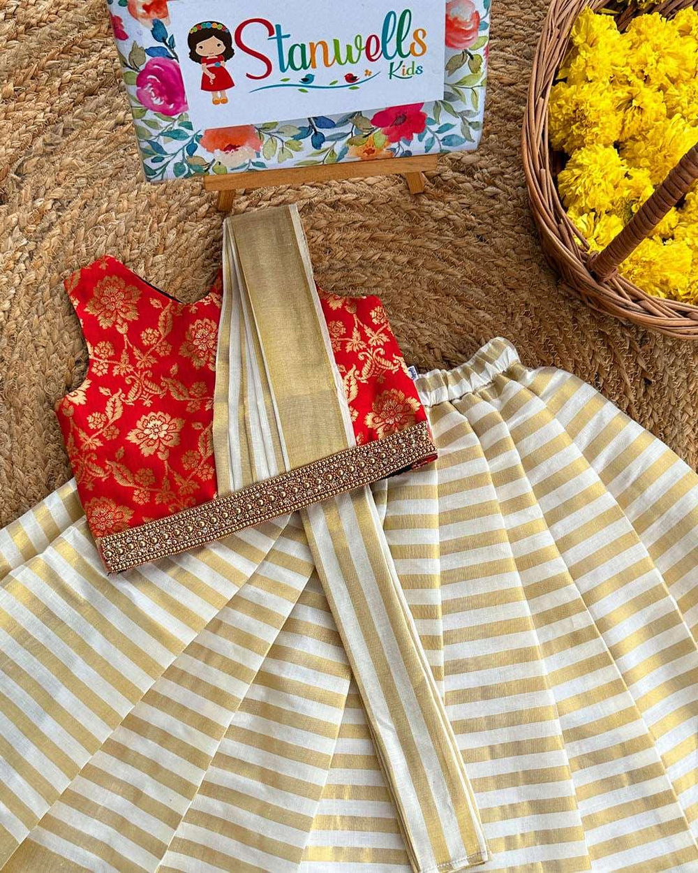Cream, Gold & Red Jacquard Semi- Dhavani Type Handwork Lehenga Choli
Skirt : Cream &amp; Gold type handloom Kerala kasavu fabric with horizontal golden lines . Inner portion of the skirt is covered with soft cotton lining fabric. Cen