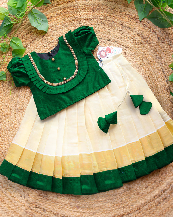 Green and cream Kerala kasavu lehenga for baby girl birthday dress traditional ethnic outfit
Bottle green and cream kasavu lehenga choli for kids festive birthday wear Kerala style
Baby girl wearing green cream kasavu lehenga traditional Onam birthday dress ethnic outfit
Kerala kasavu lehenga choli green cream color kids party wear birthday dress
Traditional green cream kasavu lehenga for girls birthday and festive wear full length outfit