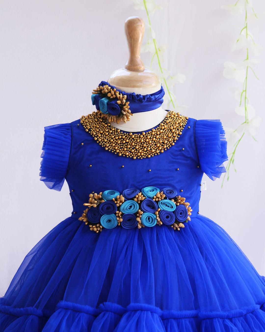 Royalblue Shade Handwork Flower Frock
Material:  Royalblue shade mono nylon net fabric with premium glossy satin as lining. Inner portion is covered with premium ultra satin and white cotton lining. cen