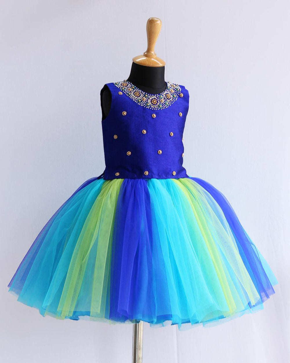 Royalblue Multi Colour Handwork Knee-length Skirt & Top
Material: Blue &amp; Green combo soft nylon net and royalblue colour blended silk fabric is used for making this beautiful skirt &amp; top .Top portion of the dress