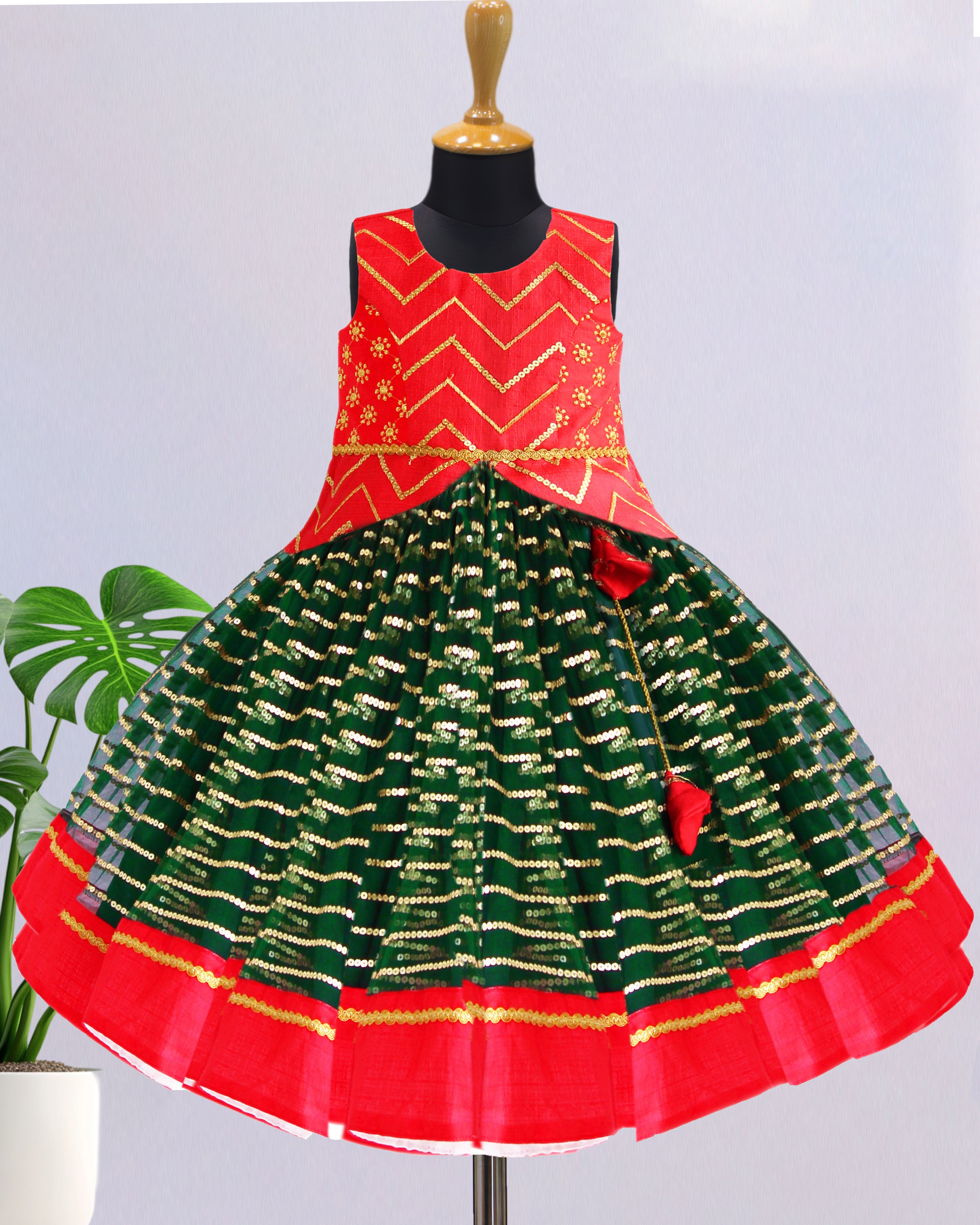 Bottle green and red sequin embroidery lehenga choli for baby girls

Traditional South Indian birthday dress for girls

Embroidered festive wear lehenga for toddlers

Designer sequin work partywear dress for kids

Baby girls ethnic lehenga choli set

Stanwells Kids festive birthday outfit

Green red designer lehenga for baby girls