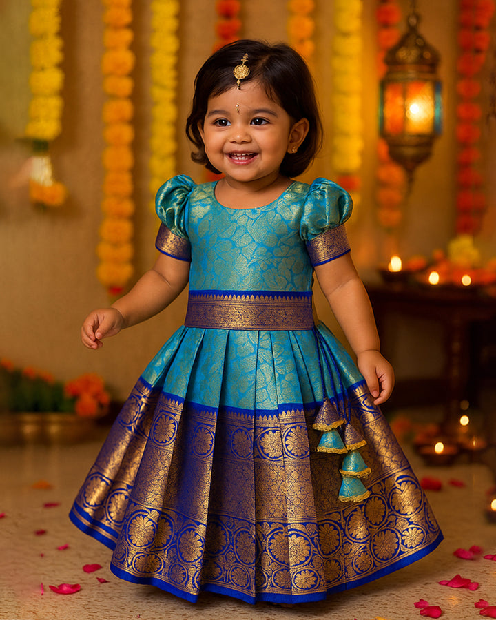 Peacock blue Banarasi silk lehenga choli for baby girls

Traditional puff sleeve dress for kids

Banarasi silk birthday dress for girls

Baby girls ethnic wear lehenga

Festive partywear dress for toddlers

Peacock blue traditional frock for baby girls

Stanwells Kids Banarasi birthday collection