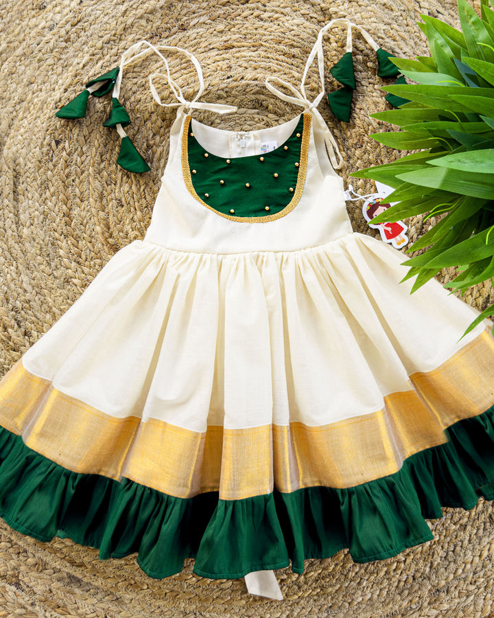 girls frocks | stanwells kids | cream frock for kids | traditional frock for kids | ethnic frocks | stanwells kids | kettuduppu for girls | noolukettu dresses | handwork frocks | green kerala dresses | kerala kasavu dresses | baby kerala dresses