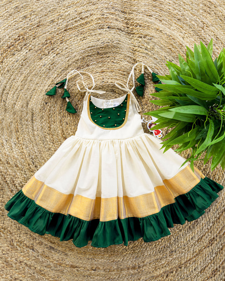 girls frocks | stanwells kids | cream frock for kids | traditional frock for kids | ethnic frocks | stanwells kids | kettuduppu for girls | noolukettu dresses | handwork frocks | green kerala dresses | kerala kasavu dresses | baby kerala dresses