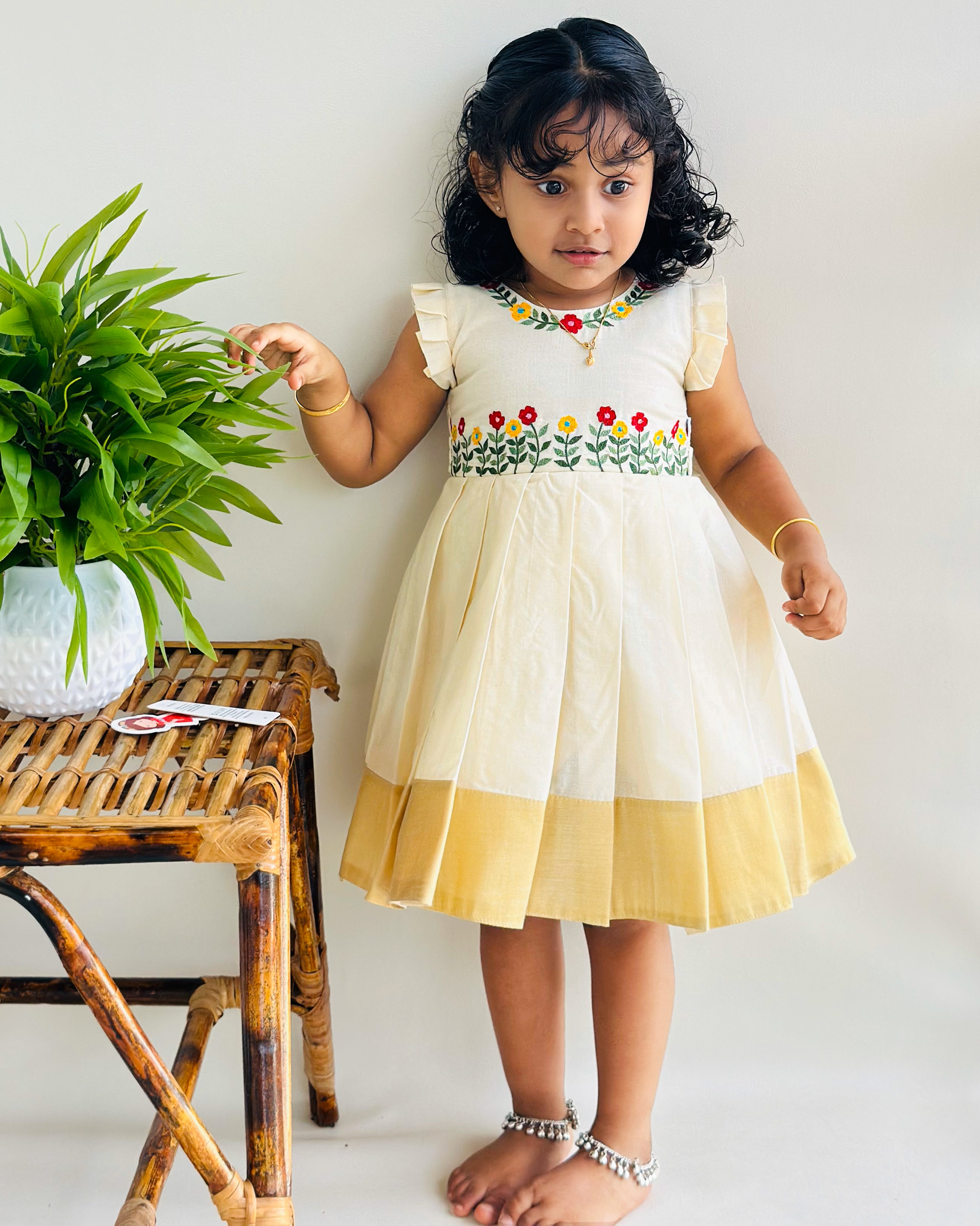 onam frock for girls, stanwells kids, ethnic dresses for girls, embroidery cotton frock for baby girls, kerala dresses, kasavu frocks, flower frocks kids 