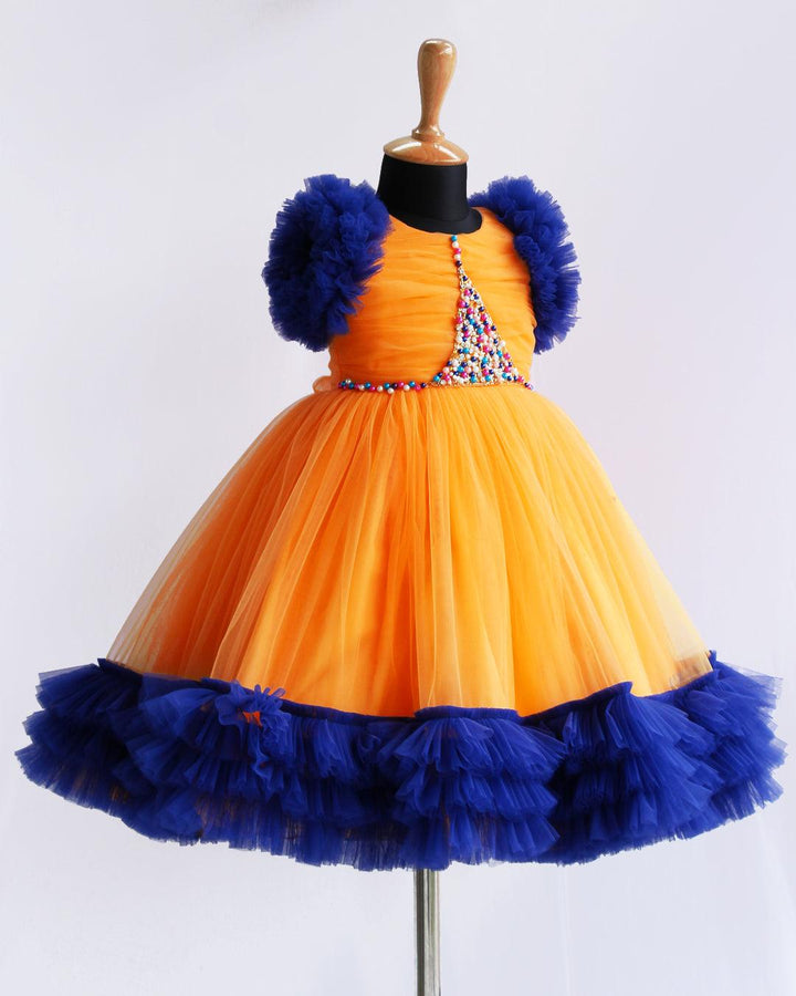 Sun Yellow & Navy blue combo Paris Handwork Birthday Gown
Material: Sun Yellow &amp; Navy blue soft nylon net is used for making this beautiful Gown .Yoke portion of the gown is designed with yellow net with multi colours 