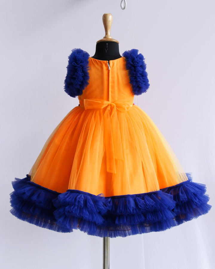 Sun Yellow & Navy blue combo Paris Handwork Birthday Gown
Material: Sun Yellow &amp; Navy blue soft nylon net is used for making this beautiful Gown .Yoke portion of the gown is designed with yellow net with multi colours 