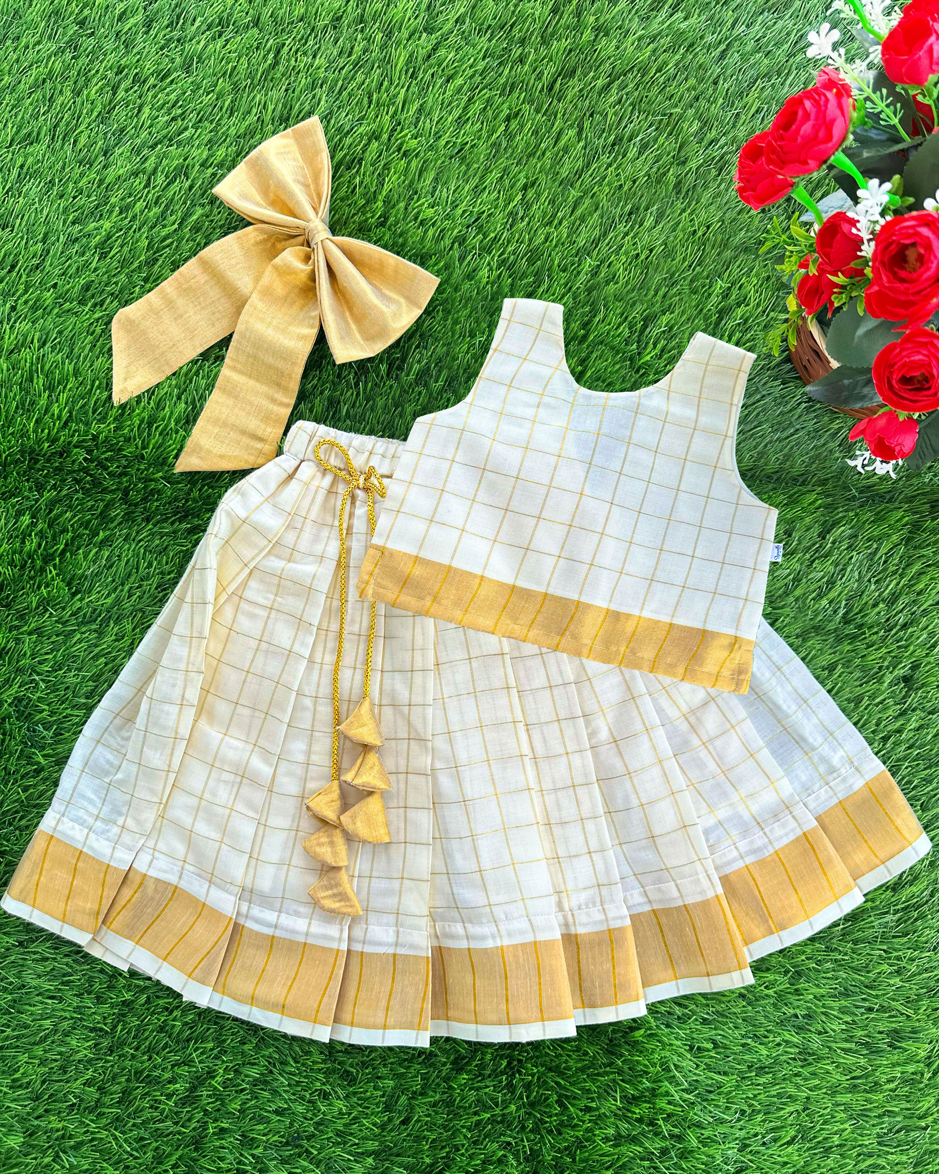 onam 2024 | onam dresses for kids | stanwells kids | golden dresses | kasavu kerala dresses kids | noolukeettu dress for kids | nakshatra kids | a r handlooms | handloom dresses for kids | matching hanging bow | check lehenga kids | kids pattupavadai | girls lehenga choli 