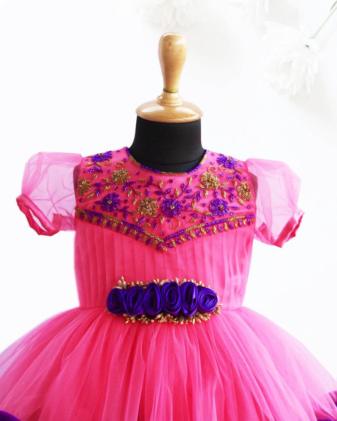 Peach & Violet combo Handwork Ruffles Party wear Frock
Material: Peach colour nylon net material is used as pleated design in the yoke portion with Heavy quality ultra satin as the primary lining .This satin lining give