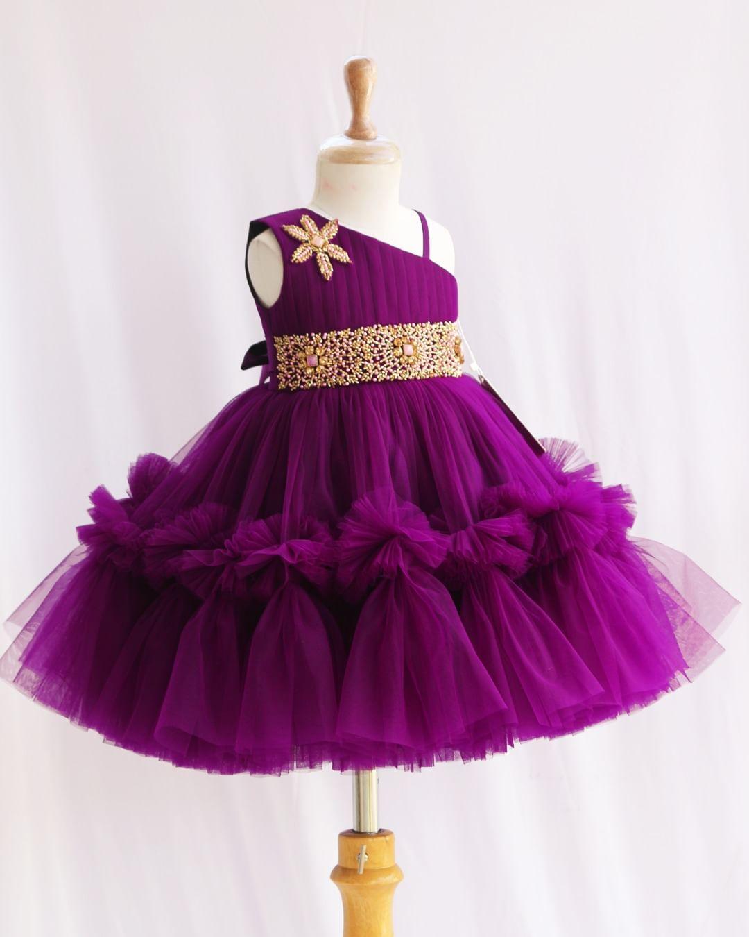 Purple Shade Pleated Ruffled Frock
Material: Purple Shade Pleated Ruffled Frock mono net with layered and ruffles on the end portion. Yoke portion is designed with pleated pattern and a handwork in t