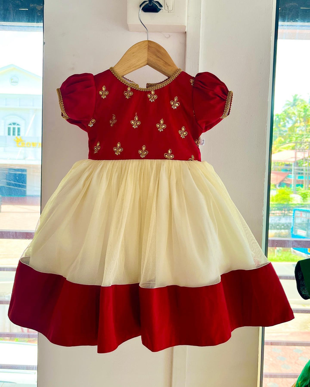 Cream & Meroon Traditional Embroidery Stone work Frock
Material: Meroon Taffetta silk top with golden embroidery stone work, Cream soft net skirt with matching border. Beautifully designed outfit for baby girls with smo