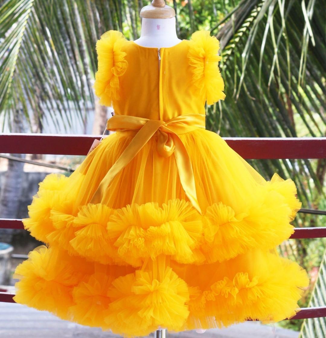 Mango Yellow Handwork Two Layer Ruffled Frock
Material: Mango Yellow  Shade Pleated Ruffled Frock mono net with layered and ruffles on the end portion. Yoke portion is designed with pleated pattern and golden b