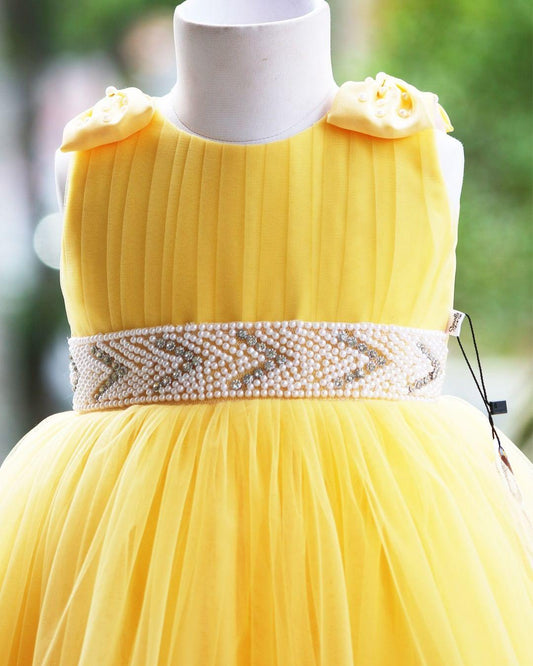 Yellow pleated bow frock side view baby girl – Stanwells Kids