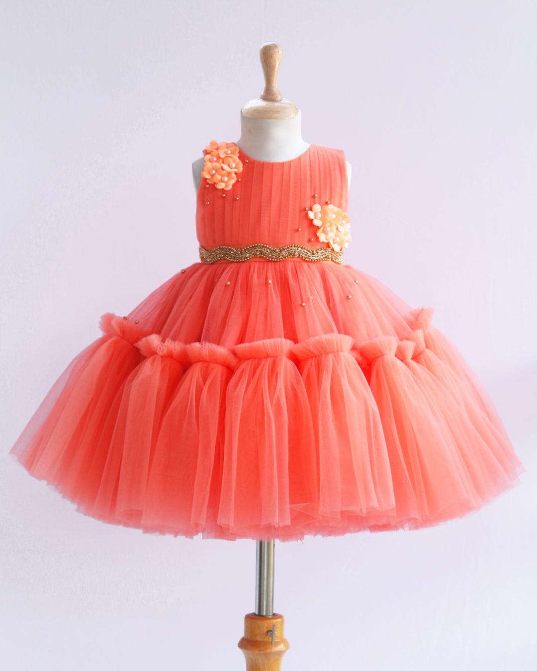 Coral Shade Pleated Ruffled Layer Frock
Material: Pleasent coral peach colour layered frock.Upper portion of the frock is done with pleated net and same colour. Cute flowers are attached on the both sides