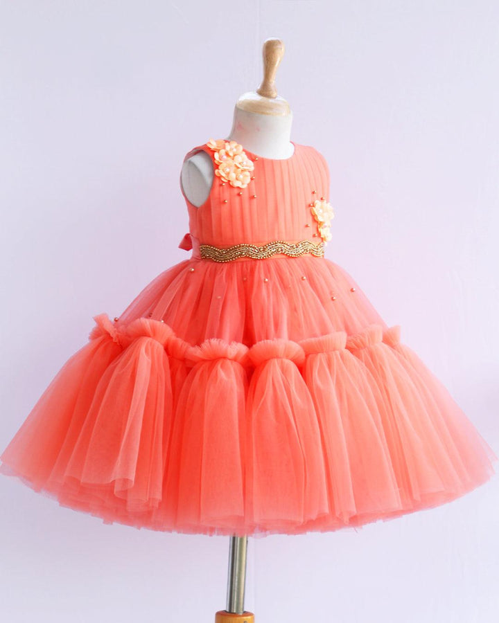 Coral Shade Pleated Ruffled Layer Frock
Material: Pleasent coral peach colour layered frock.Upper portion of the frock is done with pleated net and same colour. Cute flowers are attached on the both sides