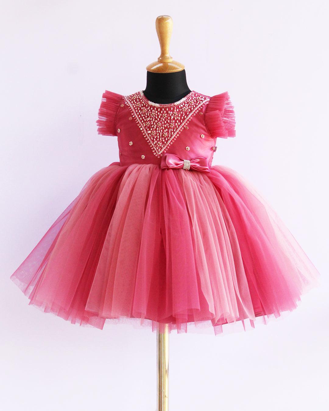 Blush Pink Handwork Layered Party wear Bow Frock
Material: Blush Pink and Baby Pink colour nylon net material is used in the yoke portion with Heavy quality ultra satin as the primary lining .This satin lining giv