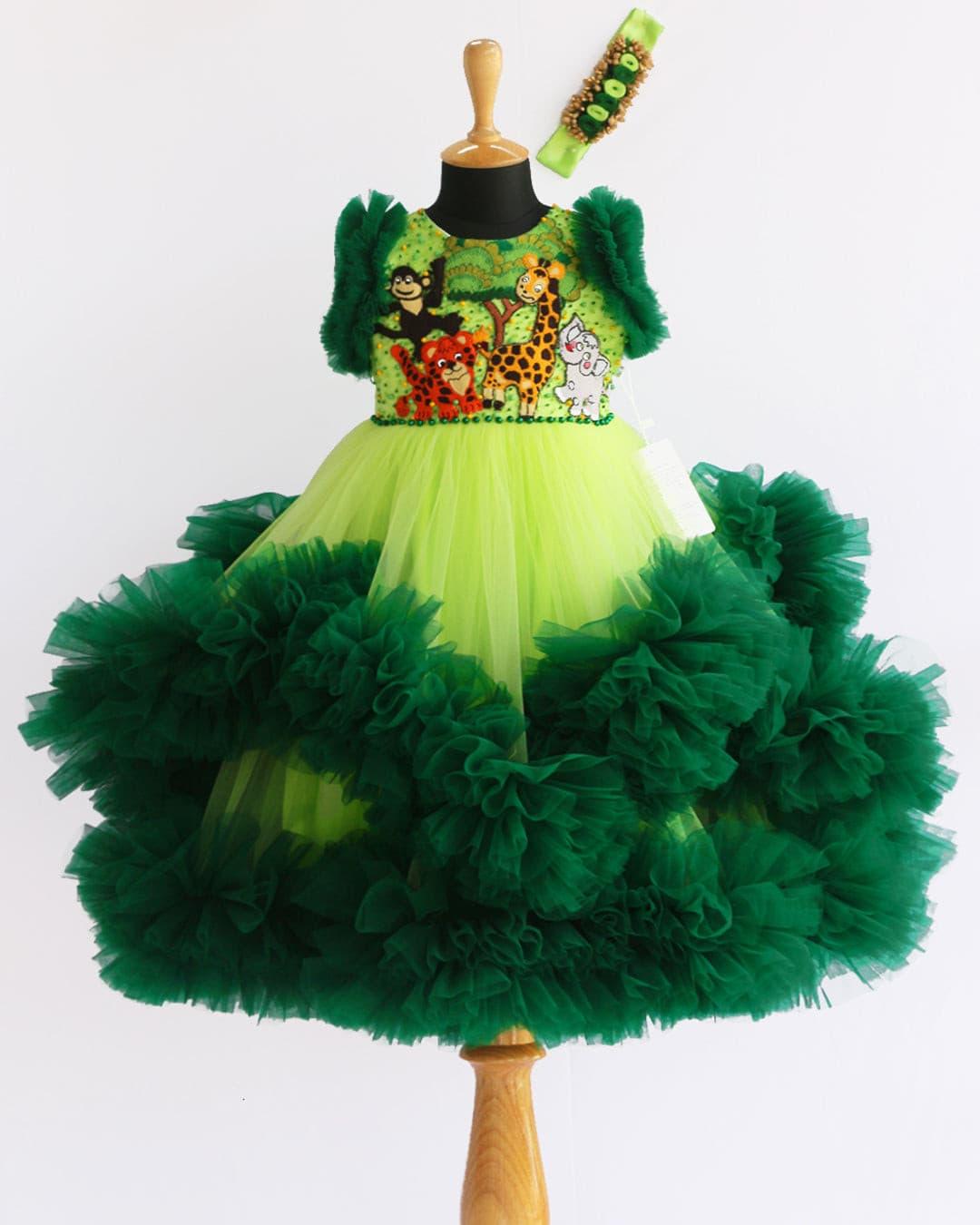 Lime Green & Dark green Animal Theme Jungle Frock
Material: Lime Green &amp; Dark Green Animal Theme Jungle Frock is made with soft nylon mono net with two layered and ruffles on each end portion. Yoke portion is d