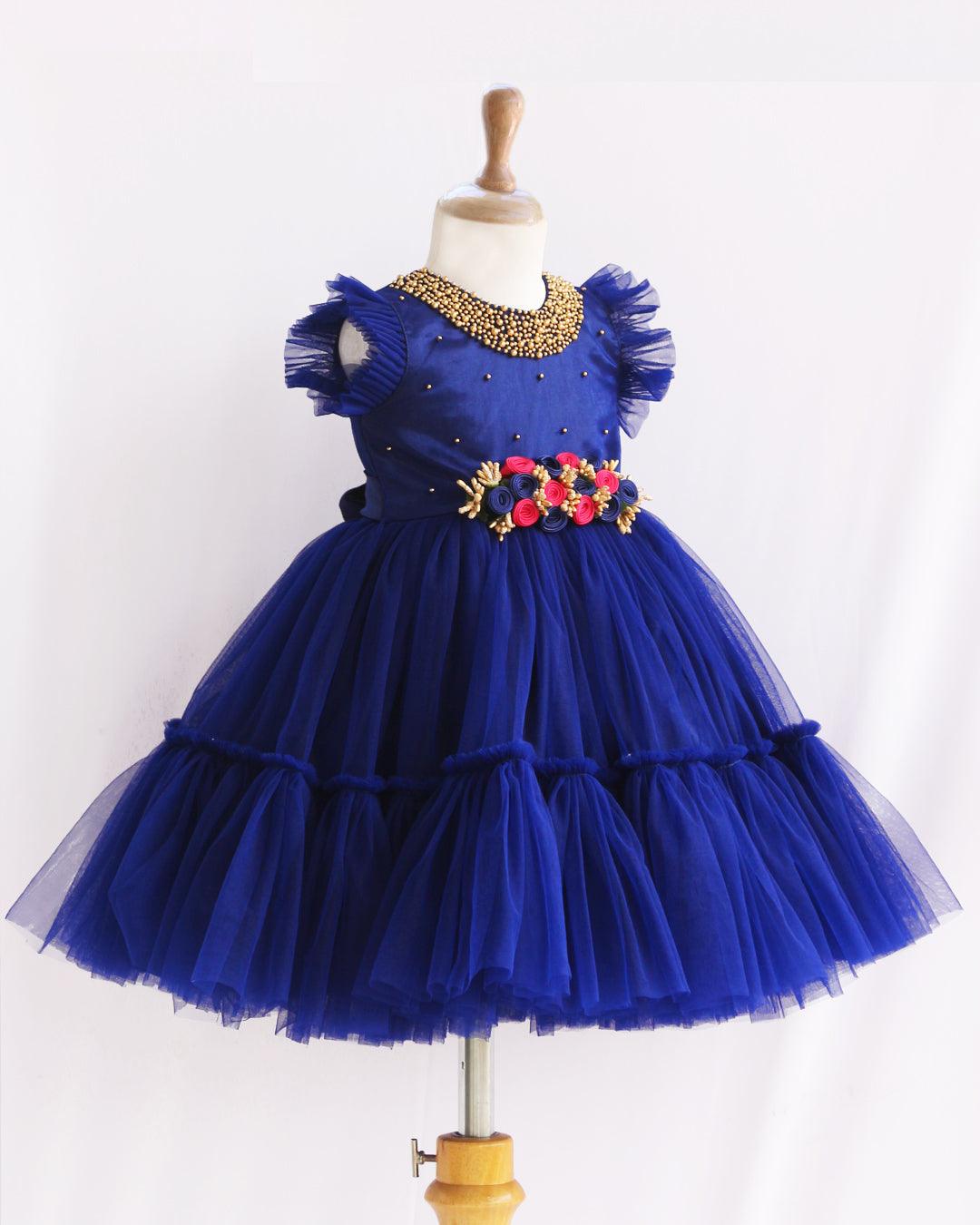 Navyblue Shade Handwork Flower Frock
Material:  Navy blue shade mono nylon net fabric with premium glossy satin as lining. Inner portion is covered with premium ultra satin and white cotton lining. Cen